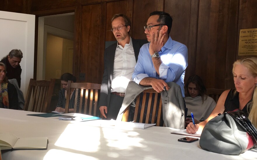 Silvio Carrillo, center, listens during a meeting with non-profit leaders.