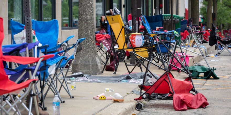 Abandoned chairs on a sidewalk in Highland Park after the mass shooting on July 4, 2022