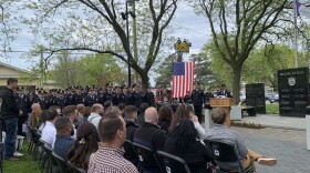 Fellow officers and close family gather in Forman Park May 13, 2024, nearly one month after the murder of Officer Michael Jensen.