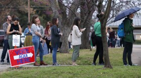 Travis County residents wait in line to vote at the Church of Christ in Hyde Park on Super Tuesday.