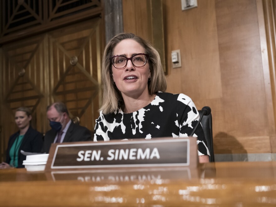 Sen. Kyrsten Sinema (D-Ariz.) said Thursday that she would "move forward" with Senate Democrats' spending bill to tackle climate change, health care and tax reforms.