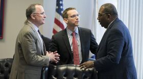Commission member Todd Williams of Dallas, left, meets with TEA Commissioner Mike Morath and state Sen. Royce West at the Texas Commission on Public School Finance on Jan. 23, 2018.