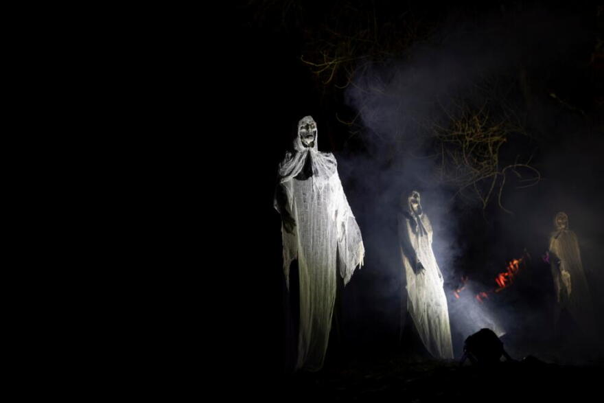 Halloween ghost statues are seen in the park during a Halloween celebration in Vilnius, Lithuania. (Mindaugas Kulbis/AP)