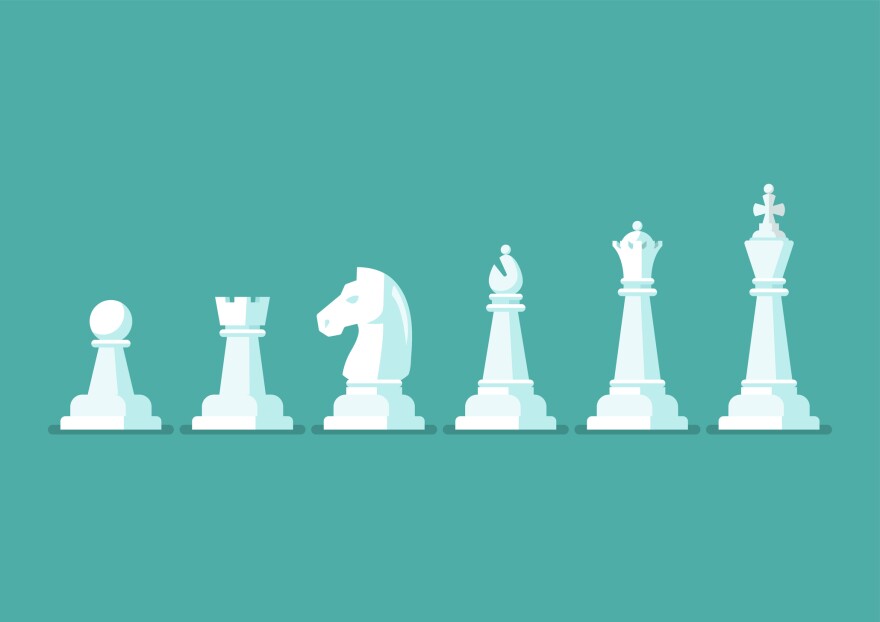 An illustration shows chess pieces