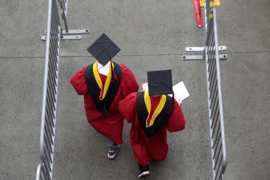 New graduates walk into the High Point Solutions Stadium before the start of the Rutgers University graduation ceremony in Piscataway Township, New Jersey. (Seth Wenig/AP)