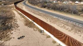 An aerial view of the area as migrants walking along razor wire after crossing the Rio Grande into the United States on January 28, 2024 in Eagle Pass, Texas. (Photo by Lokman Vural Elibol/Anadolu via Getty Images)