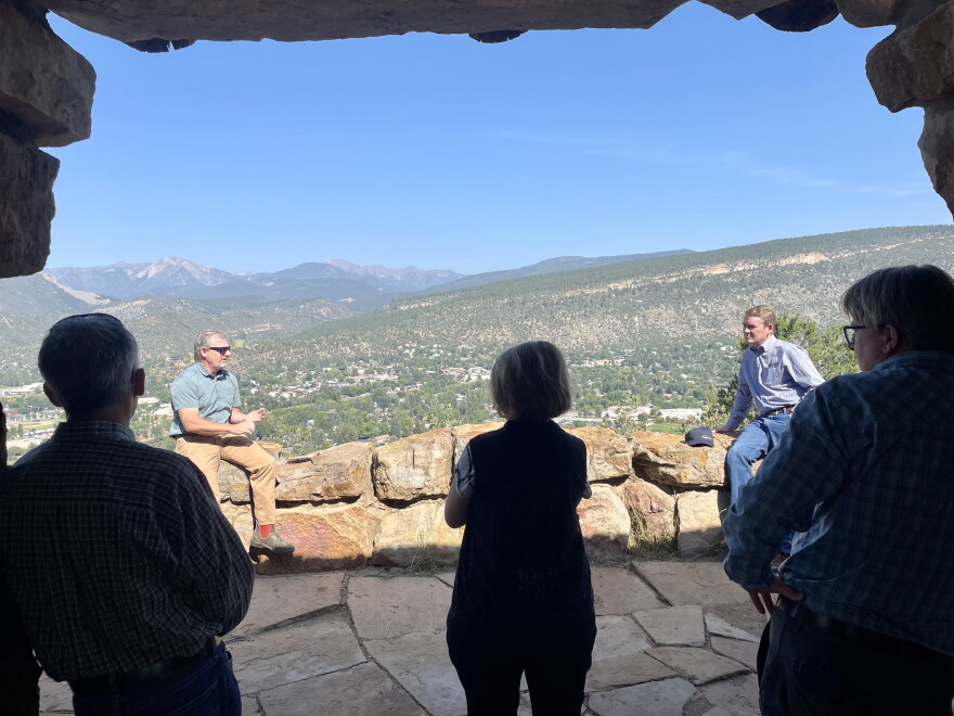 Aaron Kimble from Mountain Studies Institute (left) speaks to Senator Michael Bennet (right) and local officials at Lion's Den at Fort Lewis College.