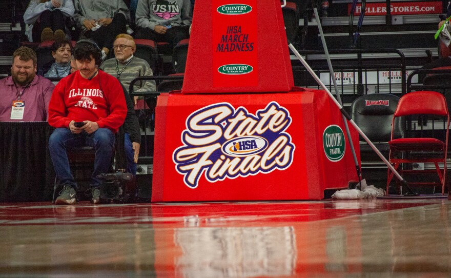 Girls high school basketball players inside an arena