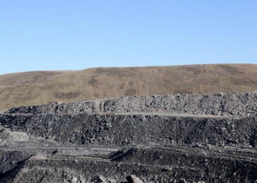 A surface mine in Letcher County, Kentucky. The reclaimed part of the mine is seeded with grass.