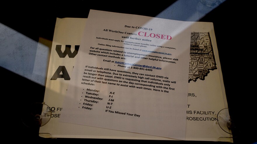 A WorkOne employment office with a closed sign on the door.