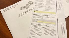 An unmarked envelope and absentee ballot for a voter in Orange County.