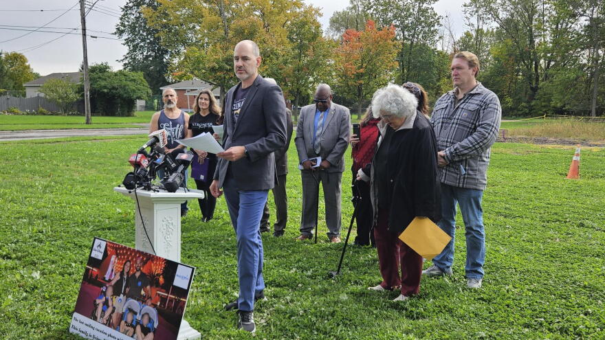 Clean Air Coalition Executive Director and Niagara Falls native Chris Murawski, front, describes his concerns with possible toxic chemicals seeping into the areas around Love Canal.