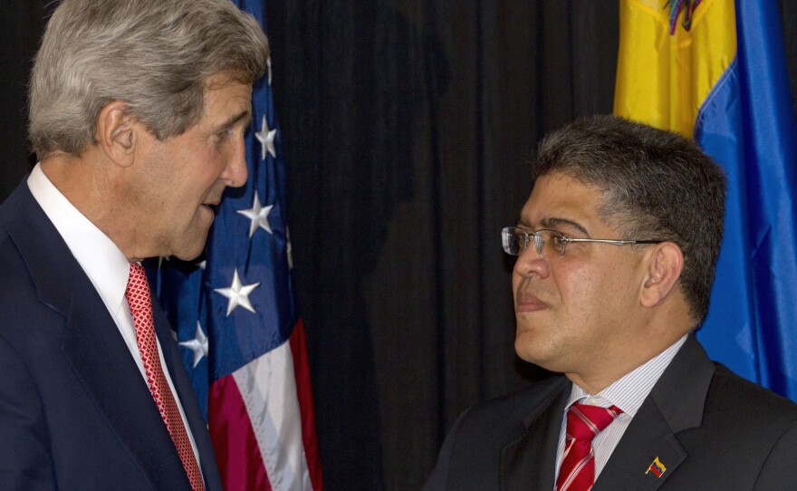 U.S. Secretary of State John Kerry (left) and Venezuelan Foreign Minister Elias Jose Jaua have tried to improve relations between the two nations, to no avail so far. They're shown here in Guatemala in June 2013.