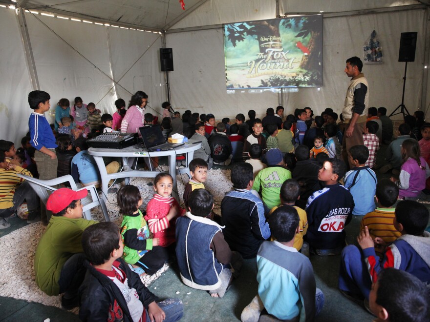 Mercy Corps organizes games and movies at the Zaatari camp to help children return to more normal activities and routines.