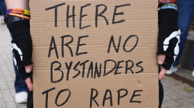 A sign held at a rally for Jane Doe in Ithaca, New York. October 4, 2026