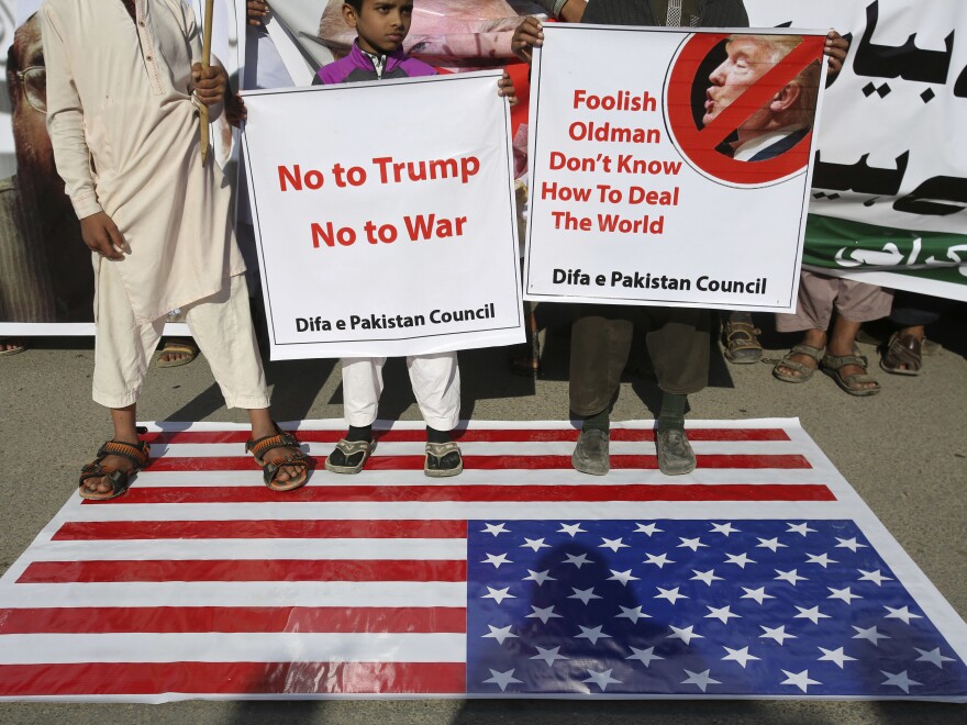 Supporters of Pakistani religious groups rally to condemn a tweet by President Trump in Karachi on Tuesday.
