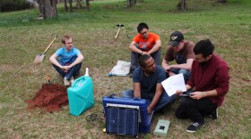 University of Oklahoma graduate students near Wellston, Okla., installing a seismometer to study central-Oklahoma's earthquake swarm