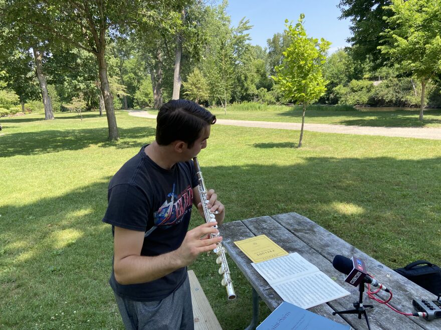 Bay City flutist Brendan Dine plays at Nelson Park in Mt. Pleasant on July 15, 2025. The recent high school graduate was the only student in Michigan to earn a perfect score at the State Solo & Ensemble Festival and will attend Central Michigan University on a full scholarship.