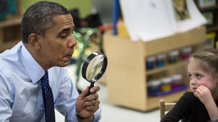 President Obama plays a learning game while visiting children at College Heights Early Childhood Learning Center on Thursday in Decatur, Ga. Obama's campaign-style trip this week was to end with a nonworking stop in Florida.