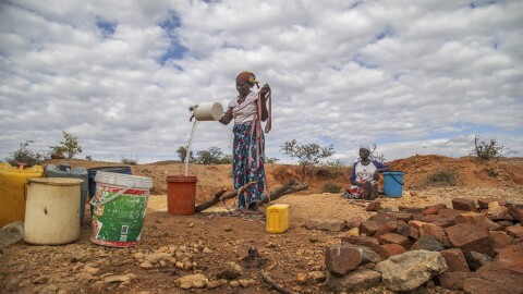 File — Villagers fetch water from a makeshift borehole in Mudzi, Zimbabwe, Tuesday, July 2, 2024. as the United Nations' food agency says months of drought in southern Africa, triggered by the El Nino weather phenomenon, has had a devastating impact on more than 27 million people and caused the region's worst hunger crisis in decades. (AP Photo/Aaron Ufumeli/File)