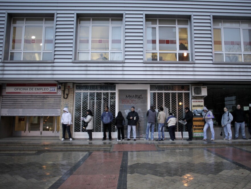 People queue outside an unemployment registry office in Madrid on Dec. 2. One in four Spaniards is out of work; about half of Spaniards in their 20s are jobless.