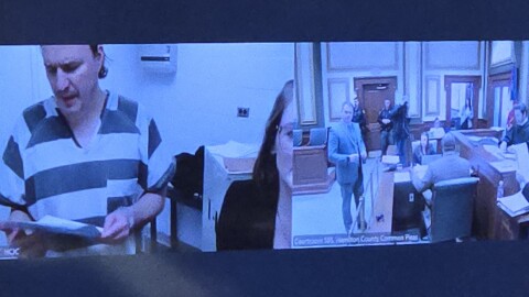Samuel Saxon reads the indictment against him during an appearance at his arraignment via video conference Friday, Dec. 12, 2025