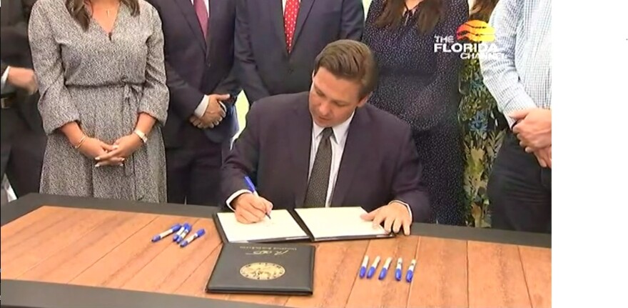 Gov. DeSantis signs the bill