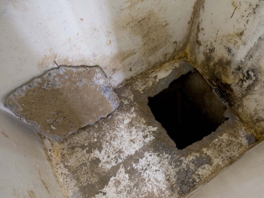 The opening of the tunnel was dug into the floor of El Chapo's cell in an area that was a blind spot for the video camera monitoring his cell.