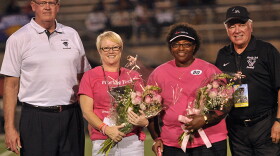 Florida Tech President and CEO Dr. Anthony J. Catanese (right) and Athletics Director Bill Jurgens (left) with a couple survivors at Panther Football's 2014 Breast Cancer Awareness Game. 