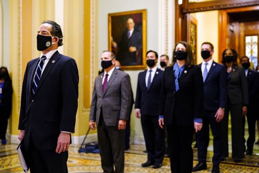 Democratic House impeachment managers stand after delivering the article of impeachment to the Senate alleging incitement of insurrection against former President Donald Trump, in Washington, Monday, Jan. 25, 2021.  (Melina Mara/The Washington Post via AP, Pool)