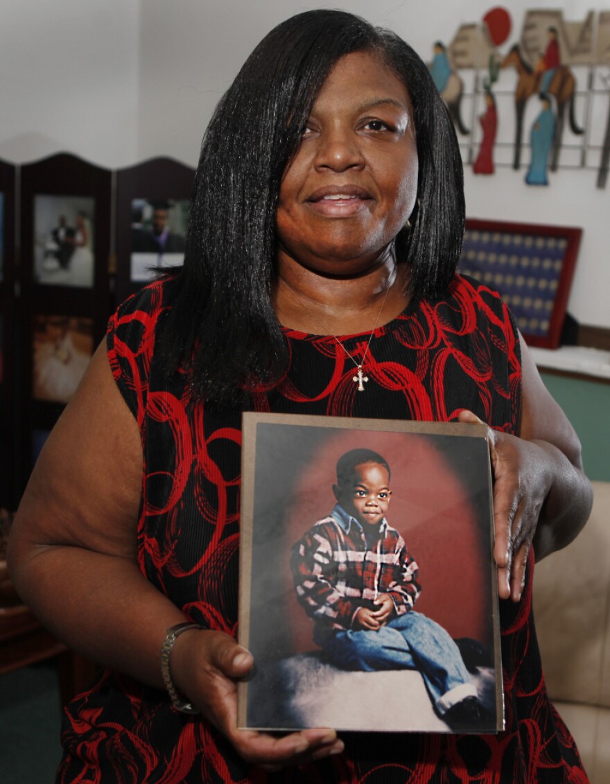 Sharletta Evans holds a photograph of her 3-year-old son Casson in Aurora, Colo., last July. Casson was killed in a drive-by shooting by two 15-year-olds.