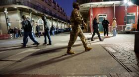 The Louisiana National Guard, military police, and Louisiana law enforcement agencies patrol the French Quarter along Bourbon Street and intersecting streets as part of a National Guard deployment for New Year's celebrations in New Orleans, Tuesday, Dec. 30, 2025. (AP Photo/Matthew Hinton)