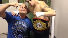 (From left) Mitch Holeve celebrates Garrett "G-Money" Holeve's victory against David "Cerebral Assassin" on Saturday night. G-Money won by submission.