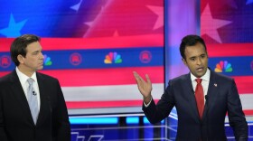 Republican presidential candidate businessman Vivek Ramaswamy speaks as Florida Gov. Ron DeSantis listens.