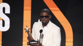 Usher accepts the award for best male R&B/pop artist during the BET Awards on Sunday, June 30, 2024, at the Peacock Theater in Los Angeles. (AP Photo/Chris Pizzello)