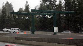As the car's bumper breaks the laser curtains, cameras capture the front and back license plates and a sensor pings for any Good To Go transponders.