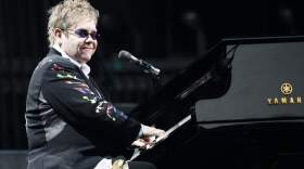 Elton John performs during a concert with Billy Joel. (Michael Dwyer/AP)