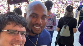 Derick Cook (right) stands with Aaron Bos-Lun (left), deputy executive director at Men4Choice, at a rally for abortion rights.