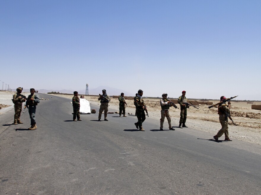 Afghan security personnel patrol after they took back control of parts of the city of Herat following fighting between Taliban and Afghan security forces on the outskirts of Herat, 640 km (397 miles) west of Kabul, Afghanistan, Sunday, Aug. 8.