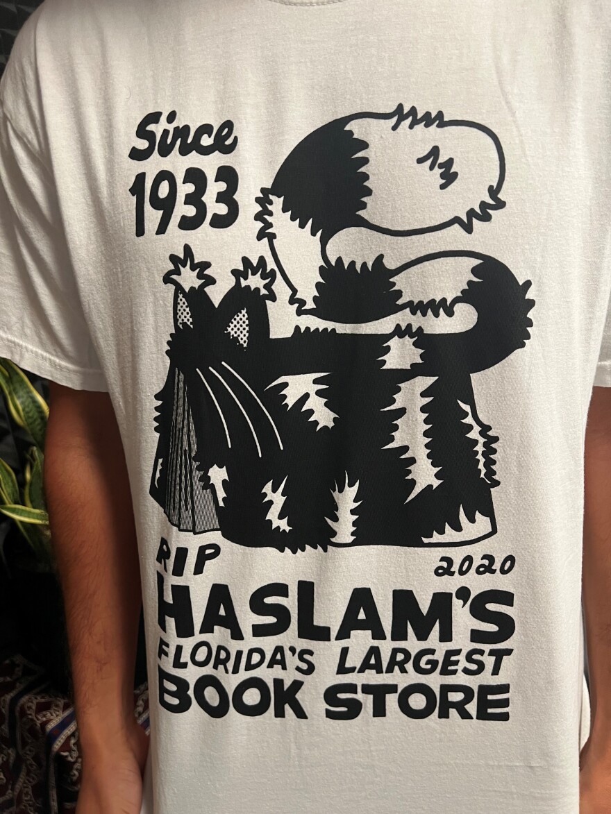 White Tshirt that says RIP Haslam's Florida's Largest Book store in black lettering 