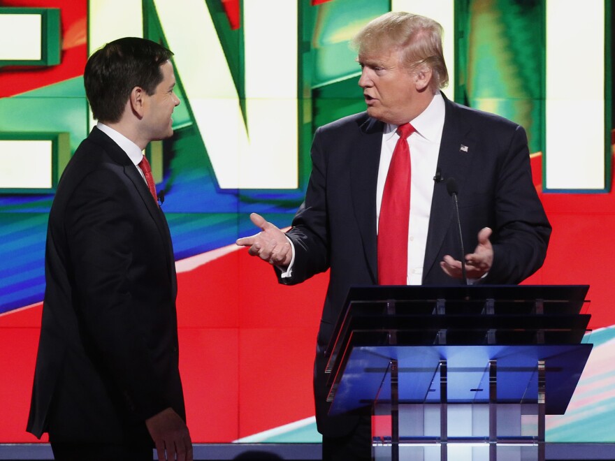 Sen. Marco Rubio, R-Fla., (left) and Donald Trump during a break in a Republican presidential debate in March.