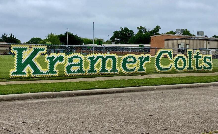 A photo of the fence surrounding Kramer Elementary School. 