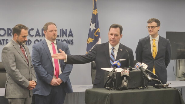 N.C. State Board of Elections executive director Sam Hayes, center, held a news conference Thursday about the start of mail-in absentee voting.
