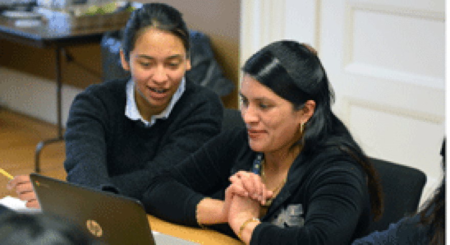 Angelica Merino Monge Helps a Migrant Farm Worker With  Spanish Literacy