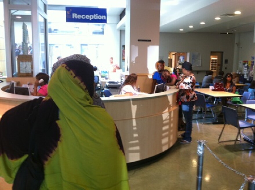 Parents and their kids line-up for registration at Seattle School District headquarters last June, prior to the school year.