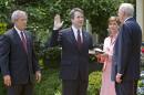Brett Kavanaugh is sworn in as a federal judge by Supreme Court Justice Anthony Kennedy in 2006. President George W. Bush looks on. Kavanaugh is Trump's pick to replace Kennedy on the Supreme Court.
