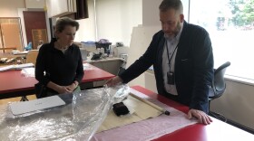 Cleveland Museum of Art Chief Conservator Per Knutas and Curator of Chinese Art Clarissa von Spee look at a painted Chinese scroll at the museum.