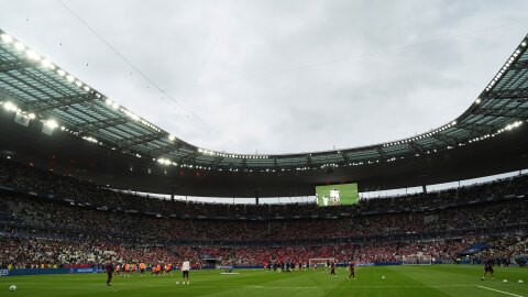 In this file photo, players of Paris Saint-Germain and Reims warm up prior to the French Cup soccer final at the Stade de France stadium in Saint-Denis, outside Paris, Saturday, May 24, 2025. The New Orleans Saints will play an international NFL game at Stade de France in 2026. 