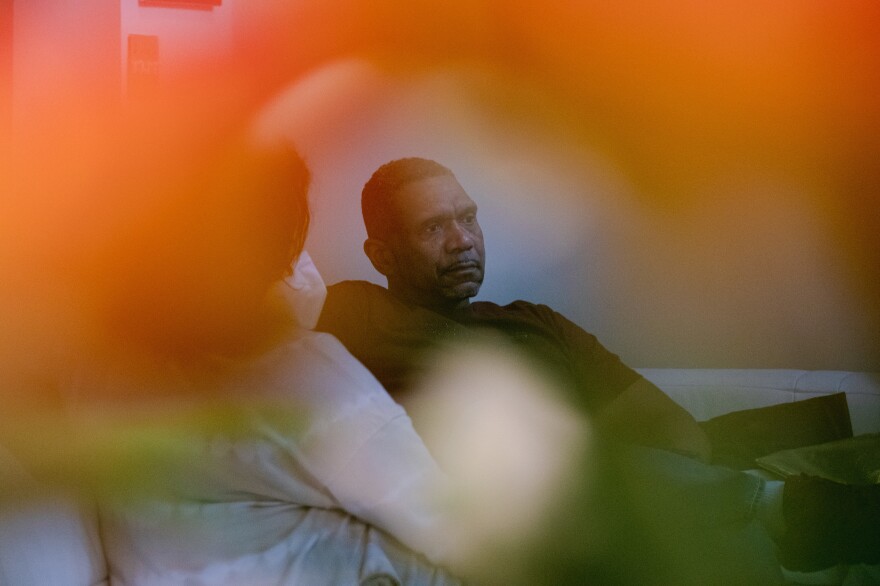 Tyrone Ferrens contemplates as he speaks to NPR reporters in his house in Aberdeen, Md.