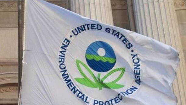 A picture of a white flag blowing in the wind that reads, "United States Environmental Protection Agency".